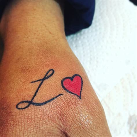 e heart tattoo|Unique Tattoo Ideas: Letter E with Heart Design